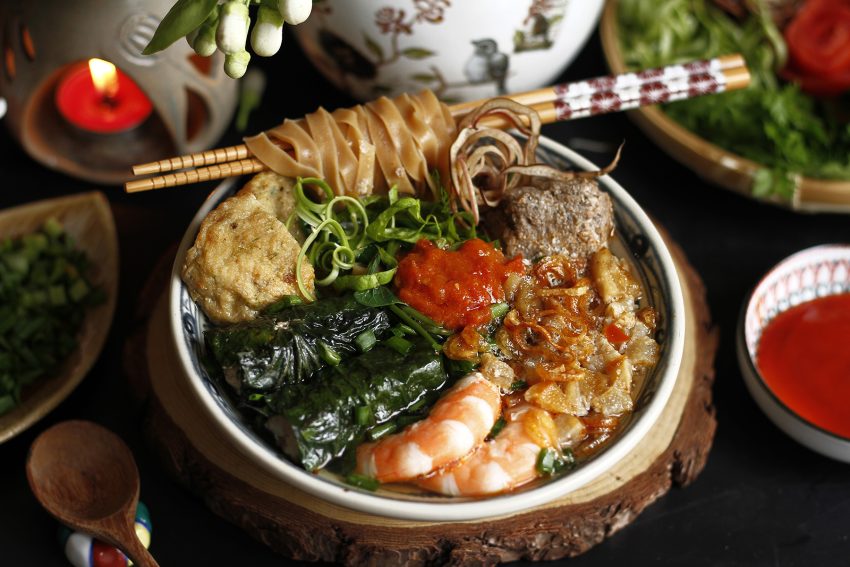 Crab cake soup with red rice noodles
